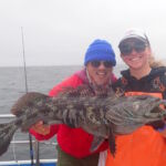 Dayton L. and Bonnie B holding a Lingcod (Ophiodon elongatus) Dayton L. and Bonnie B. holding a lingcod on a CCFRP trip