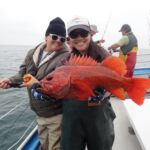 Toni M with Jen C. holding a Vermilion Rockfish (Sebastes miniatus) Toni M. and Jen C. with a vermilion rockfish on a CCFRP trip