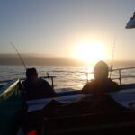 Sunrise and calm seas before a great fishing day at Ano Nuevo. sunrise over two volunteer anglers on a CCFRP trip