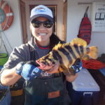 Jen C. holding a magnificent Treefish (Sebastes serriceps) Jen C. with a treefish on a CCFRP trip