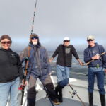 Carol J., Darrell B., David K. and Matt M. taking a break in between drifts on the bow Carol J. DarrellB, David K. and Matt M. taking a fishing break on the bow on a CCFRP trip