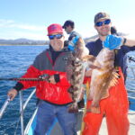 Benny R. and James W. showing off a double catch of a Lingcod (Ophiodon elongatus) and a Copper Rockfish (Sebastes caurinus) Benny R. and Jimmy W. holding a lingcod and a copper rockfish on a CCFRP trip