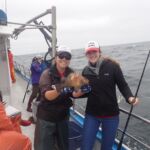 Jen C. and Paige B. posing with a Quillback Rockfish (Sebastes maliger) Jen C. and Paige B. with a quillback rockfish on a CCFRP trip