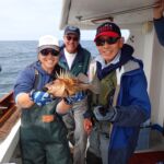 Captain Tom M., and Ken Y. getting ready to measure a Quillback Rockfish (Sebastes maliger) Jen C., Captain Tom M., and Ken Y. with a quillback rockfish on a CCFRP trip