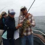 Lead field scientist, Erica M., checks out a Kelp Bass (Paralabrax clathratus) tag recapture! Lead field scientist, Erica M., checks out a Kelp Bass (Paralabrax clathratus) tag recapture!