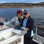 SIO science crew showing off an Olive Rockfish (Sebastes serranoides) on the F/V Sum Fun prior to release SIO science crew showing off an Olive Rockfish (Sebastes serranoides) on the F/V Sum Fun prior to release