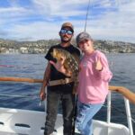 Volunteer anglers show off a Kelp Bass (Paralabrax clathratus) that was caught and released on the F/V Sum Fun Volunteer anglers show off a Kelp Bass (Paralabrax clathratus) that was caught and released on the F/V Sum Fun