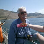 Bill M. and a precious Calico Rockfish (Sebastes dalli) thatw as caught and released at the Point Buchon MPA Bill M. and a precious Calico Rockfish (Sebastes dalli) thatw as caught and released at the Point Buchon MPA