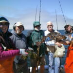 Rose D., Ralph B., Jim W., Bill M., Jason A., and Chandler S.H. showing off two Lingcod (Ophiodon elongatus) caught and released in the Piedras Blancas reference cells Rose D., Ralph B., Jim W., Bill M., Jason A., and Chandler S.H. showing off two Lingcod (Ophiodon elongatus) caught on a CCFRP trip