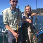 Volunteer anglers show off their catch on a CCFRP sampling trip Volunteer anglers show off their catch on a CCFRP sampling trip