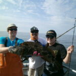 Rose D., Eddie G., and Erica A. with a tagged Lingcod (Ophiodon elongatus) Rose D., Eddie G., and Erica A. with a tagged Lingcod (Ophiodon elongatus) caught on a CCFRP trip