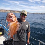 A volunteer angler proudly shows off his Copper Rockfish (Sebastes caurinus) prior to release A volunteer angler proudly shows off his Copper Rockfish (Sebastes caurinus) prior to release
