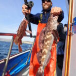 An excited volunteer angler shows off his Brown Rockfish (Sebastes auriculatus) and Lingcod (Ophiodon elongatus) double catch! An excited volunteer angler shows off his Brown Rockfish (Sebastes auriculatus) and Lingcod (Ophiodon elongatus) double catch!