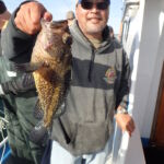 Volunteer angler, Lester Y., with an awesome China Rockfish (Sebastes nebulosus) prior to release Volunteer angler, Lester Y., with an awesome China Rockfish (Sebastes nebulosus) prior to release