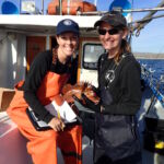 Erin S. and Helen with a Copper Rockfish (Sebastes caurinus) Erin S. and a science crew members with a Copper Rockfish (Sebastes caurinus)