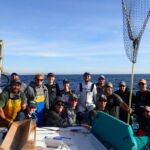 Volunteer anglers and crew aboard the F/V Huli Cat after a day of sampling Volunteer anglers and crew aboard the F/V Huli Cat after a day of sampling