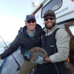 Connor D. and volunteer angler show off a Southern Rock Sole (Lepidopsetta billineta) prior to release Connor D. and volunteer angler show off a Southern Rock Sole (Lepidopsetta billineta) prior to release