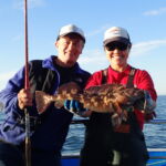 Volunteer angler Dave K. and Jen C. show off his Lingcod (Ophiodon elongatus) prior to release Volunteer angler Dave K. and Jen C. show off his Lingcod (Ophiodon elongatus) prior to release