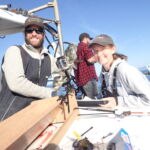 The BML science crew team with a Lingcod (Ophiodon elongatus) at the tagging station The BML science crew team with a Lingcod (Ophiodon elongatus) at the tagging station