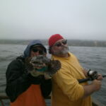 Matt M. and Phil E. with a tagged Cabezon (Scorpaenichthys marmoratus) Matt M. and Phil E. with a tagged Cabezon (Scorpaenichthys marmoratus) caught on a CCFRP trip