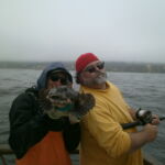 Matt M. and Phil E. with a tagged Cabezon (Scorpaenichthys marmoratus) Matt M. and Phil E. with a tagged Cabezon (Scorpaenichthys marmoratus) caught on a CCFRP trip