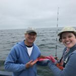 Tim D. and Rose D. with a Rosy Rockfish (Sebastes rosaceus) Tim D. and Rose D. with a Rosy Rockfish (Sebastes rosaceus)