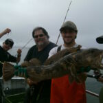 Zach K. and volunteer angler Phil E. with a Lingcod (Ophiodon elongatus) Zach K. and volunteer angler Phil E. with a Lingcod (Ophiodon elongatus)