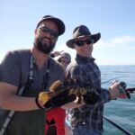 Franz and a volunteer angler display a cool Black and Yellow Rockfish (Sebastes chrysomelas) prior to release Franz and a volunteer angler display a cool Black and Yellow Rockfish (Sebastes chrysomelas) prior to release