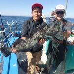 Volunteer angler Ruben and science crew member Jen C. show off a massive blue Lingcod (Ophiodon elongatus) prior to release Volunteer angler Ruben and science crew member Jen C. show off a massive blue Lingcod (Ophiodon elongatus) prior to release