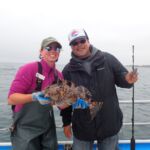 Katie C. with Lester Y. showing off a Cabezon (Scorpaenichthys marmoratus) Katie C. and Lester Y. with a cabezon on a CCFRP trip