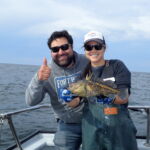 Juan P. and Jen C. holding a China Rockfish (Sebastes nebulosus) Juan P. and Jen C. holding a china rockfish on a CCFRP trip