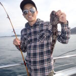 Michael H. with his young Lingcod (Ophiodon elongatus) Michael H. and a young lingcod on a CCFRP trip