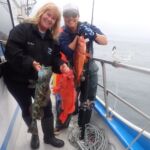 Bev S. and Jen C. with a Lingcod (Ophiodon elongatus), Vermilion Rockfish (Sebastes miniatus) and Bocaccio Rockfish (Sebastes paucispinis) Bev S. and Jen C. with a Lingcod, Vermilion Rockfish, and Bocaccio Rockfish on a CCFRP trip