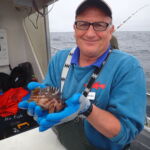 R.Starr holding a Gopher rockfish on a CCFRP trip