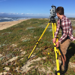 Tyler Barnes Surveying at Moss Landing State Beach with the Terrestrial Laser Scanner Tyler Barnes in the field with a TLS