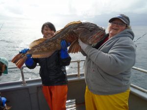 Laurel and Phyillis holding lingcod