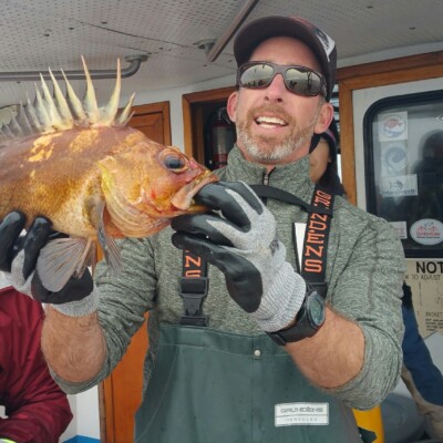 Scott Hamilton holding a Quillback Rockfish