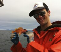 Ryan Fields holding rosy rockfish