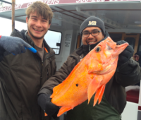 Isidro Blanco and Travis Brooks holding Canary Rockfish caught off Washington