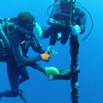 Divers attaching MOBY tether to the mooring line