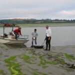 The WEMAP 2002 Intertidal Wetlands project required innovative ways to reach a site. Most sites involved using a boat to get to the shallowest point and then walking to the exposed intertidal site dragging the equipment. In some cases, we walked in mud up to our thighs or we had to skid along the surface on boogie boards. The WEMAP 2002 Intertidal Wetlands project required innovative ways to reach a site. Most sites involved using a boat to get to the shallowest point and then walking to the exposed intertidal site dragging the equipment. In some cases, we walked in mud up to our thighs or we had to skid along the surface on boogie boards.