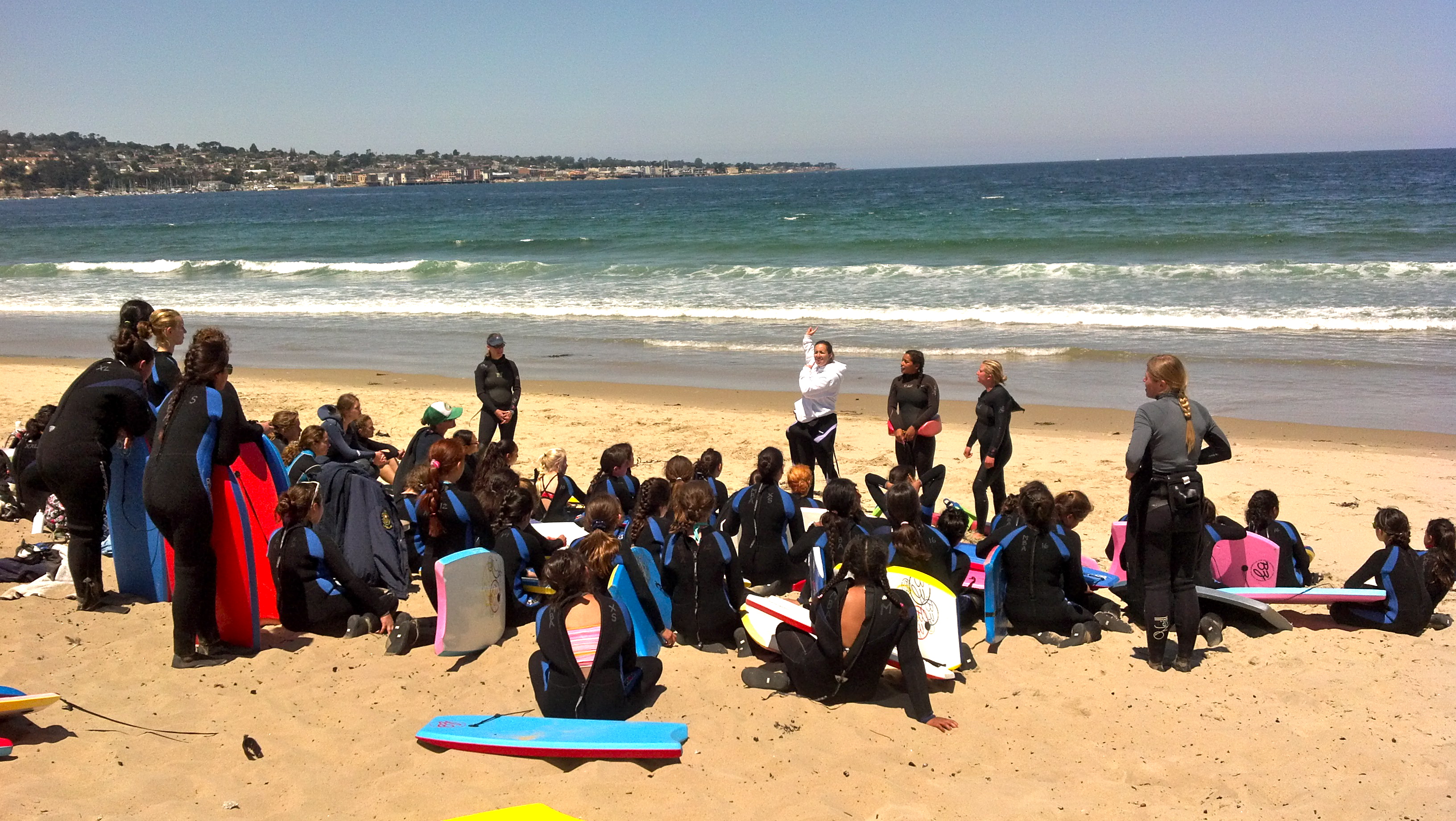 Lifeguards explaining some water safety ideas before we head into the water