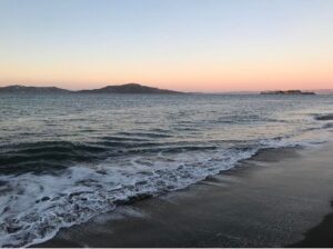 Photo of beach waves at sunset