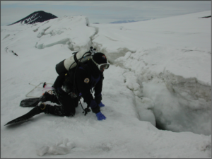 Andrew Thurber using the seal technique of accessing the ocean.