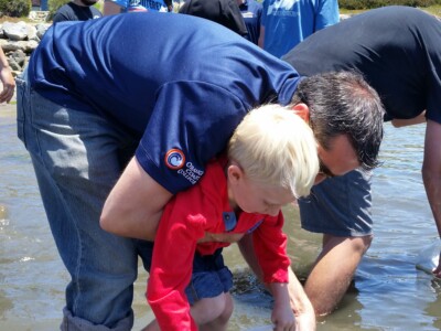 Kids releasing their white seabass.